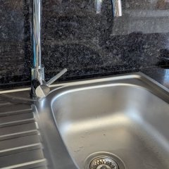 A antiga torneira de cozinha